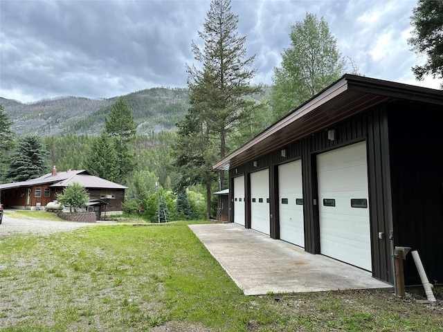 8 Cedar Gulch Ln, Thompson Falls, MT 59873 - view of grassy yard featuring a mountain view and an outbuilding