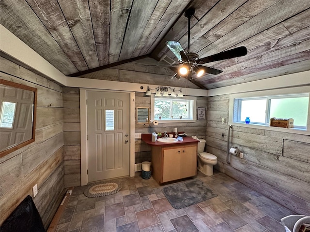 8 Cedar Gulch Ln, Thompson Falls, MT 59873 - bathroom with wood walls, vanity, ceiling fan, stone finish flooring, and wooden ceiling