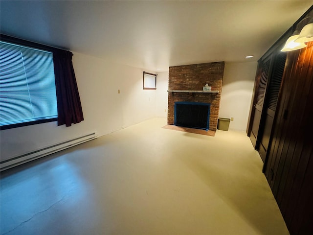 8 Cedar Gulch Ln, Thompson Falls, MT 59873 - unfurnished living room featuring a baseboard heating unit, a fireplace, and concrete floors