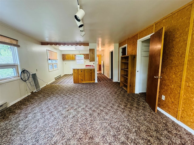 kitchen featuring dark carpet and track lighting