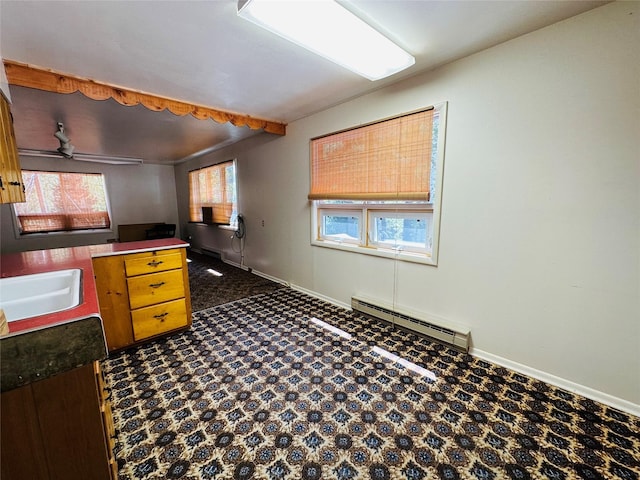 8 Cedar Gulch Ln, Thompson Falls, MT 59873 - kitchen featuring a baseboard radiator, dark countertops, and ceiling fan