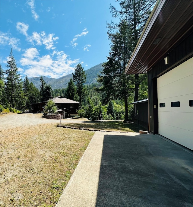 8 Cedar Gulch Ln, Thompson Falls, MT 59873 - view of green lawn with a mountain view