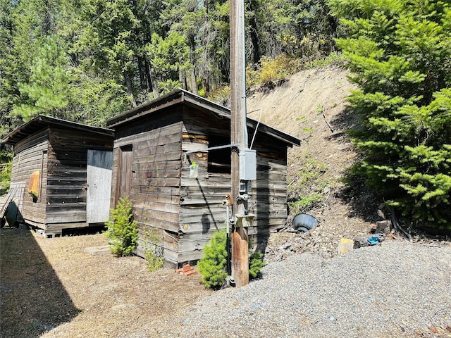 view of home's exterior featuring a shed