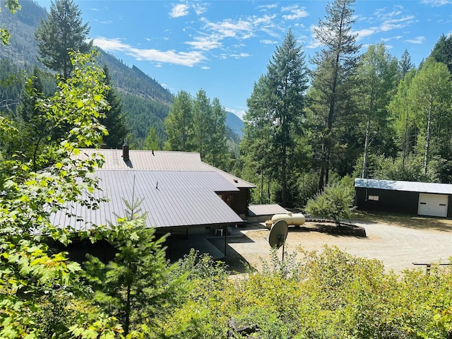 exterior space featuring a mountain view and an outbuilding