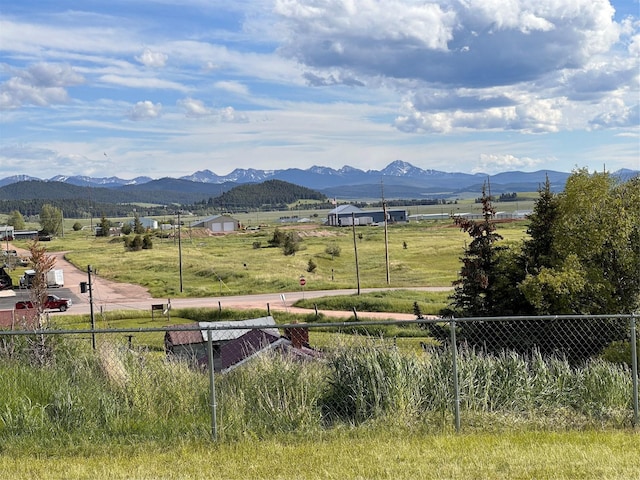 view of mountain feature with a rural view