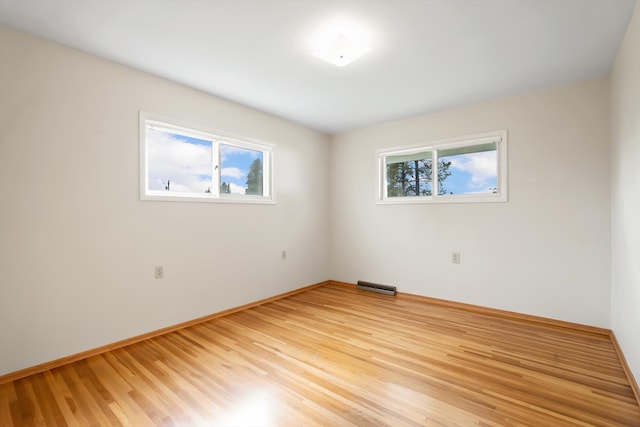 spare room featuring light hardwood / wood-style floors