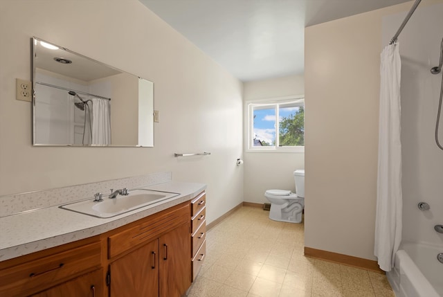 full bathroom with vanity, shower / tub combo, and toilet