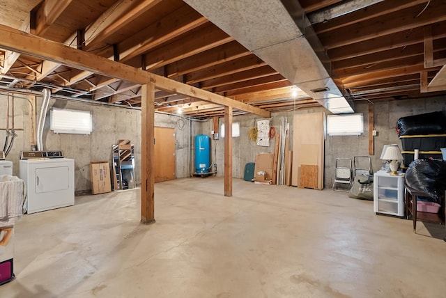 basement featuring washing machine and dryer and plenty of natural light