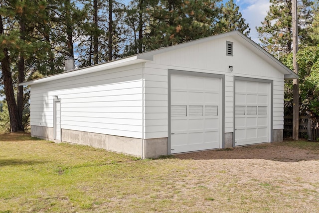 garage with a lawn