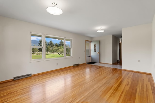 spare room with light wood-type flooring