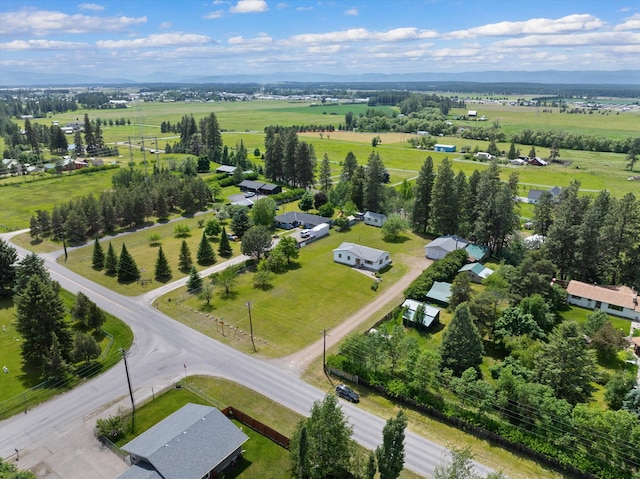 birds eye view of property with a rural view