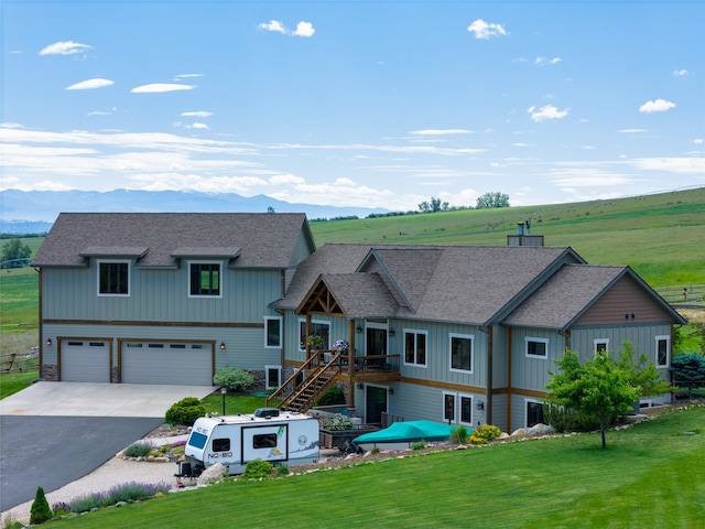 view of front of property with a garage and a front yard