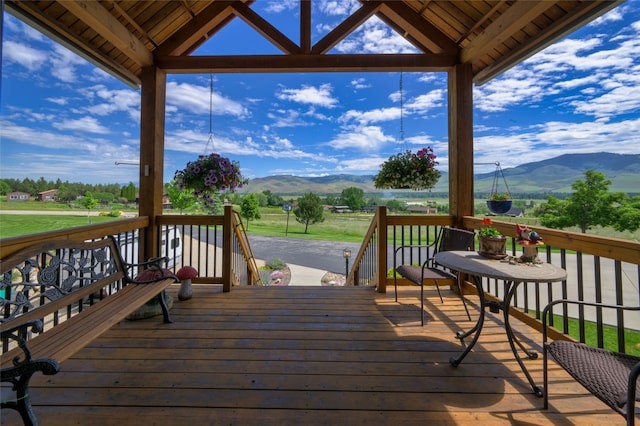 wooden terrace featuring a mountain view