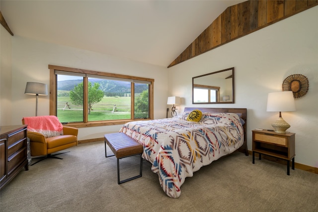 bedroom with high vaulted ceiling and carpet flooring