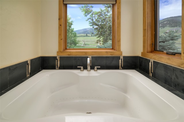 room details featuring a tub to relax in