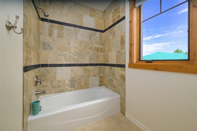 bathroom with tiled shower / bath combo and tile patterned floors