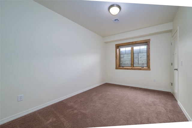 unfurnished room featuring carpet