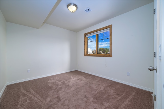 spare room with carpet floors