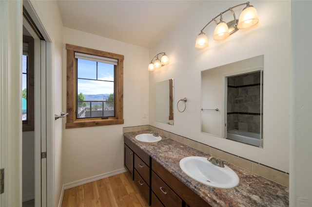 bathroom with hardwood / wood-style floors and dual bowl vanity