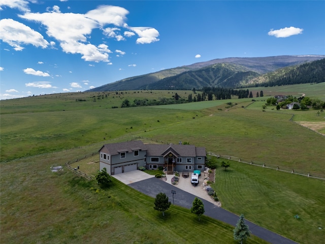 aerial view with a mountain view and a rural view