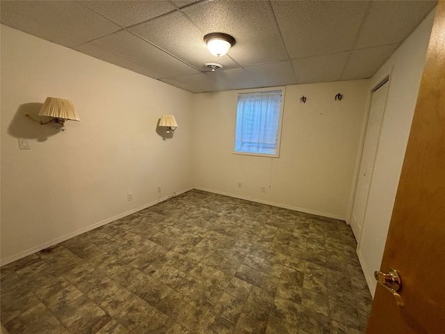 spare room featuring a paneled ceiling