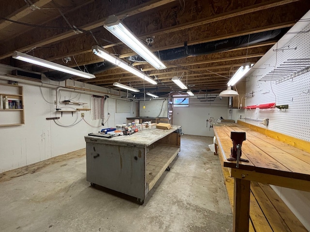 basement with a workshop area