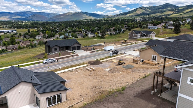 birds eye view of property featuring a mountain view