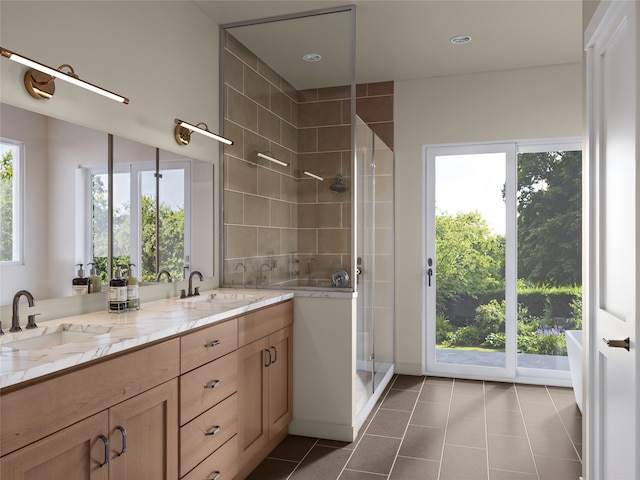 bathroom with vanity, tile patterned floors, a wealth of natural light, and an enclosed shower