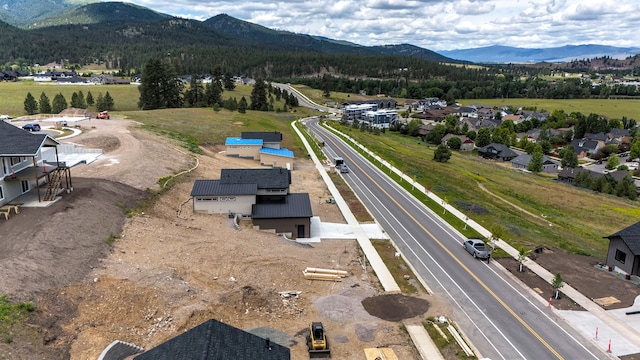 birds eye view of property with a mountain view