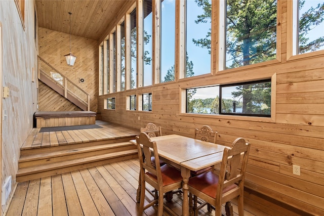 interior space featuring wooden walls and hardwood / wood-style floors