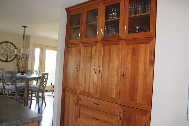 interior space featuring french doors and hanging light fixtures