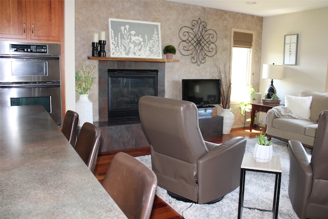 living room featuring a fireplace and hardwood / wood-style floors