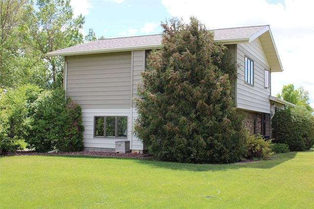 view of home's exterior featuring a lawn