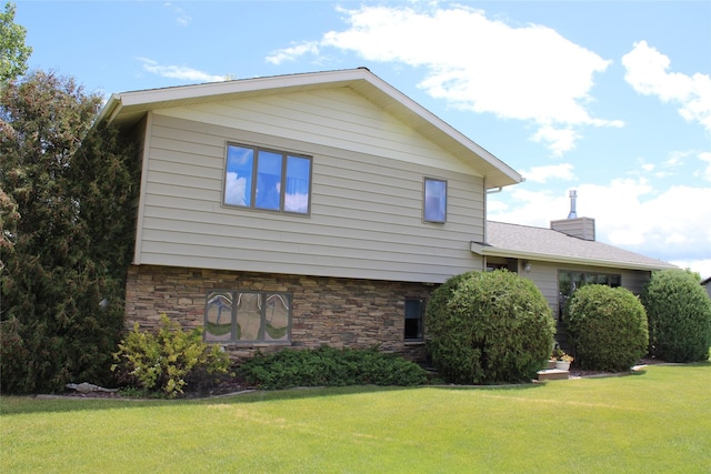 view of home's exterior featuring a lawn