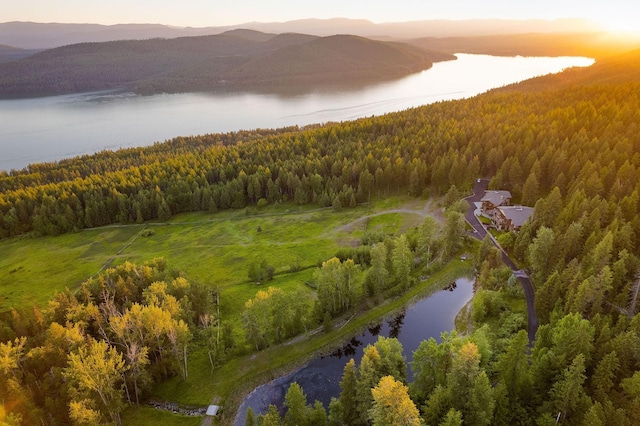 aerial view at dusk with a water and mountain view