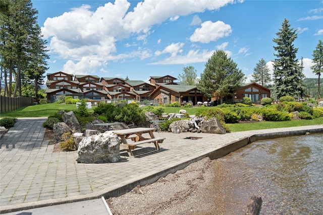 view of property's community with a residential view and a patio