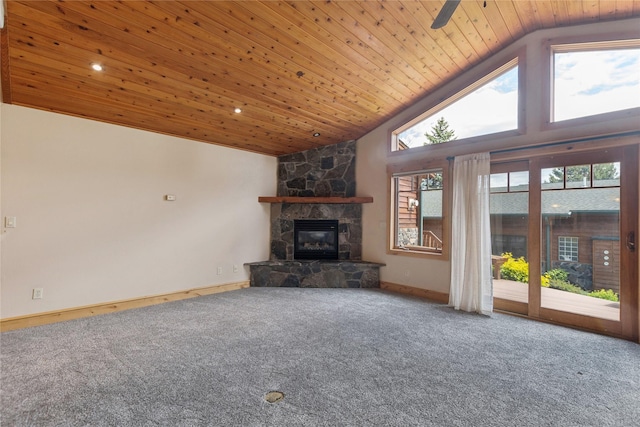 unfurnished living room featuring carpet floors, a fireplace, high vaulted ceiling, and wood ceiling