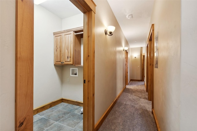 hall featuring carpet floors and baseboards