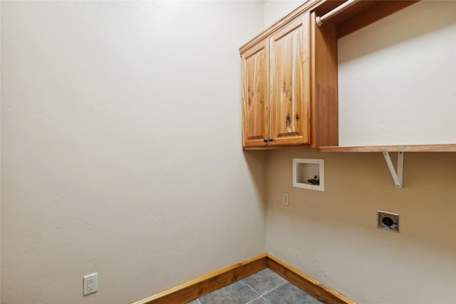 washroom featuring baseboards, hookup for a washing machine, cabinet space, and hookup for an electric dryer