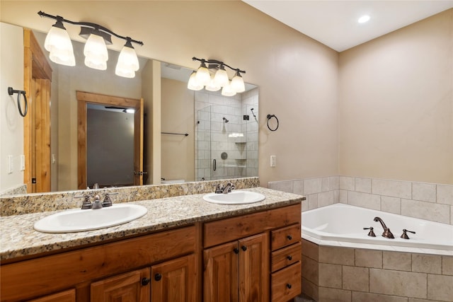 bathroom with a stall shower, a sink, a bath, and double vanity