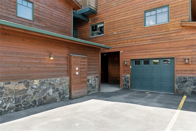 view of exterior entry with concrete driveway