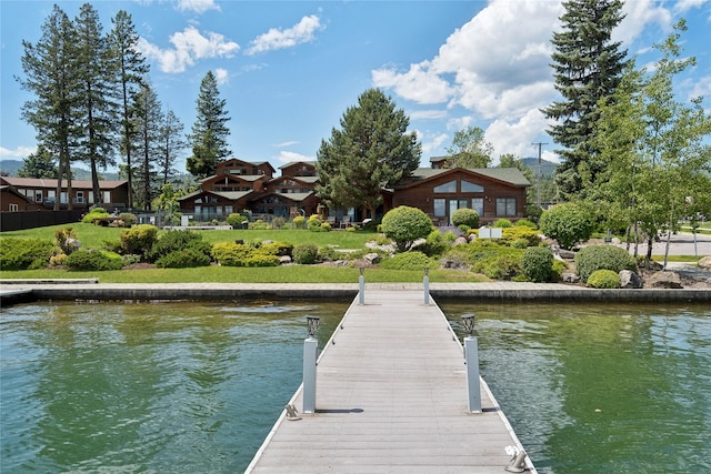 dock area featuring a water view and a residential view