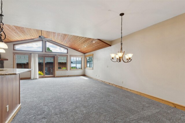 unfurnished living room featuring lofted ceiling, ceiling fan with notable chandelier, carpet, and wood ceiling