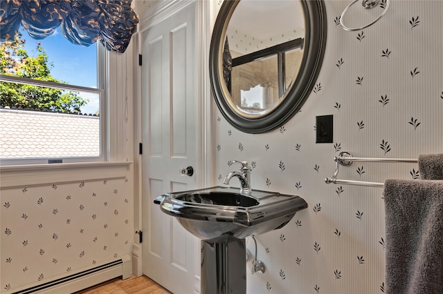 bathroom with a baseboard radiator