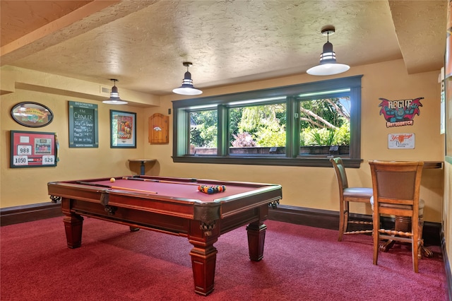 playroom featuring a textured ceiling, pool table, carpet flooring, and baseboards