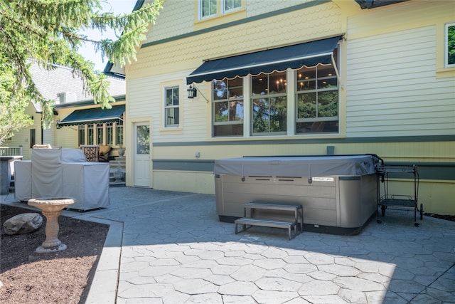 view of patio with a hot tub