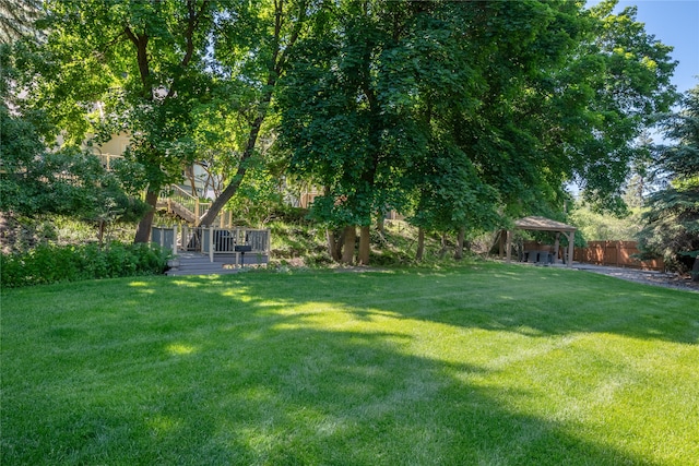 view of yard with a gazebo and fence