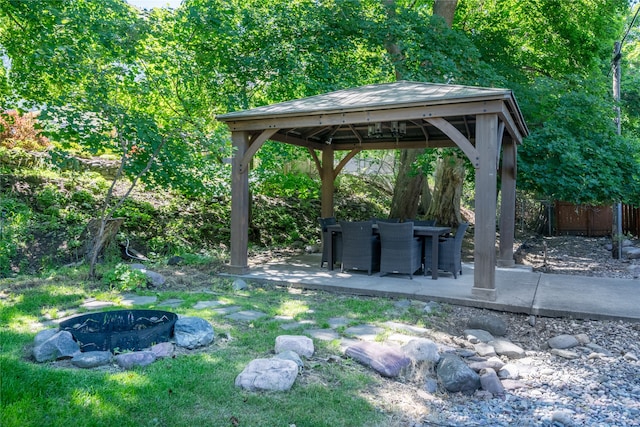 view of yard with a patio area, an outdoor fire pit, fence, and a gazebo