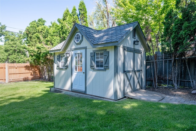 view of shed featuring a fenced backyard