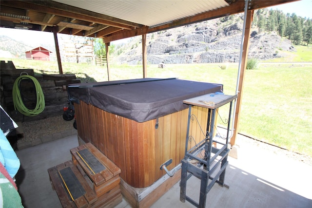 view of patio / terrace featuring a hot tub